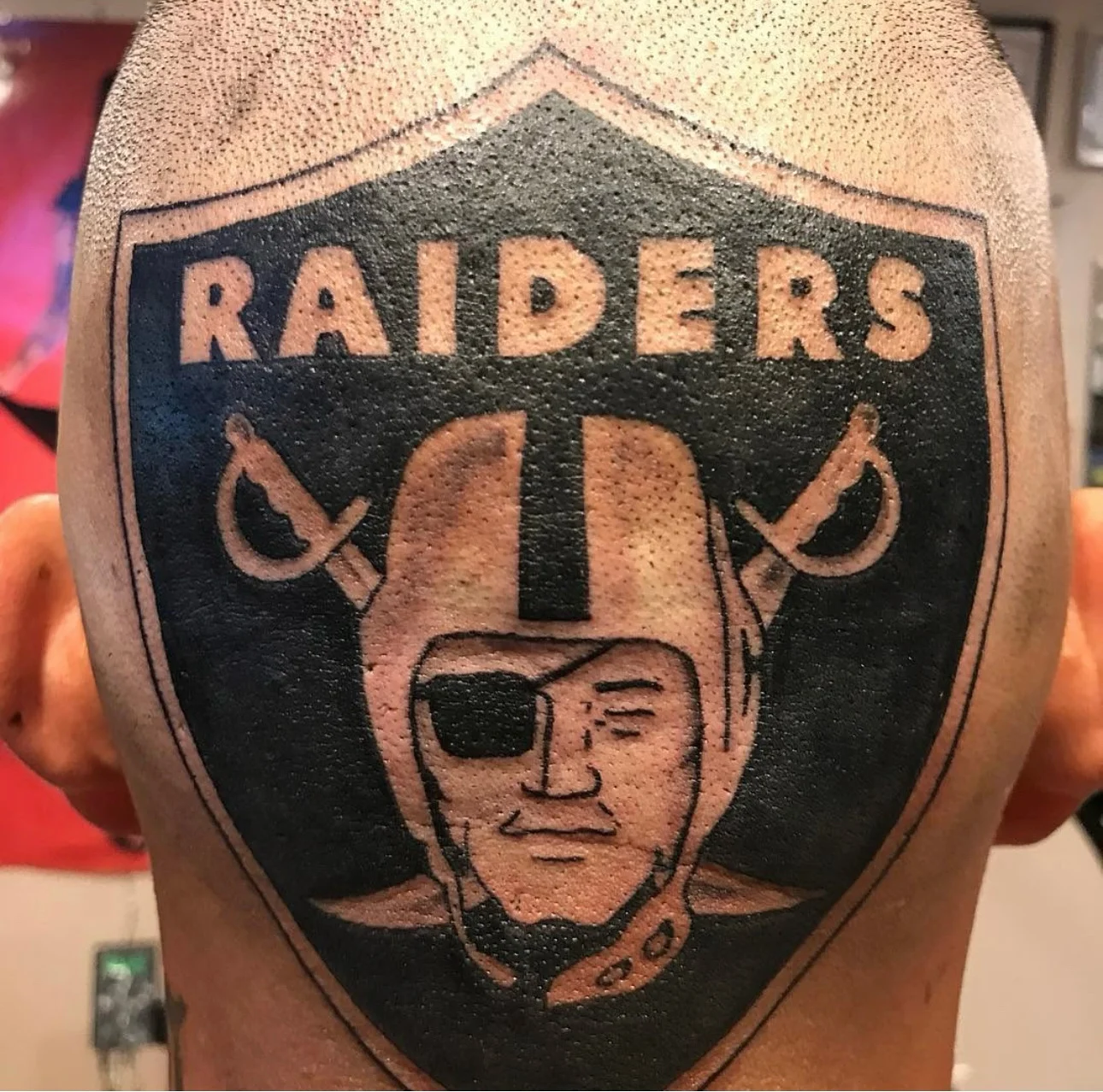 Blackwork tattoo by Bumpy Munoz: helmet, eye patch, crossed swords, face