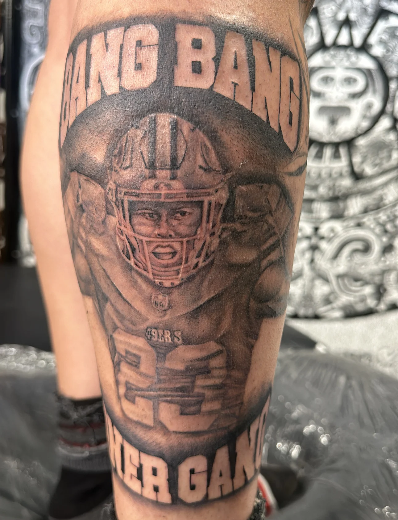 Black & Gray Realism tattoo by Bumpy Munoz: football player, helmet, nfl logo, 49ers jersey