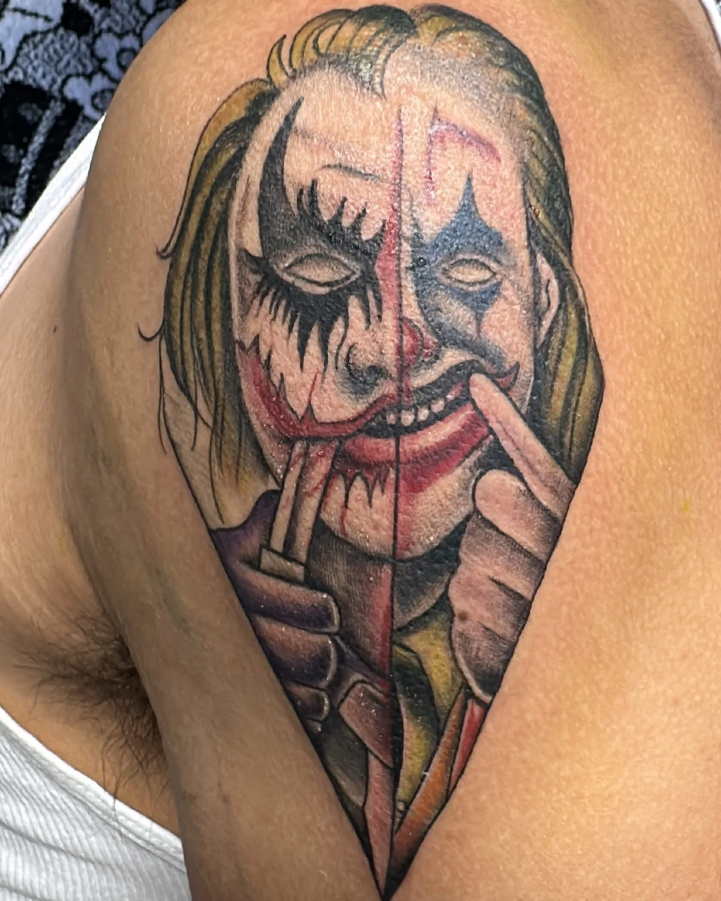 Color Realism tattoo by Bumpy Munoz: joker, face paint, two-faced, smiling