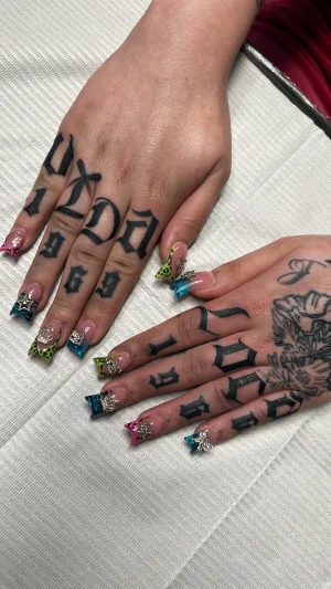 Bold Gothic Lettering Hand Tattoo