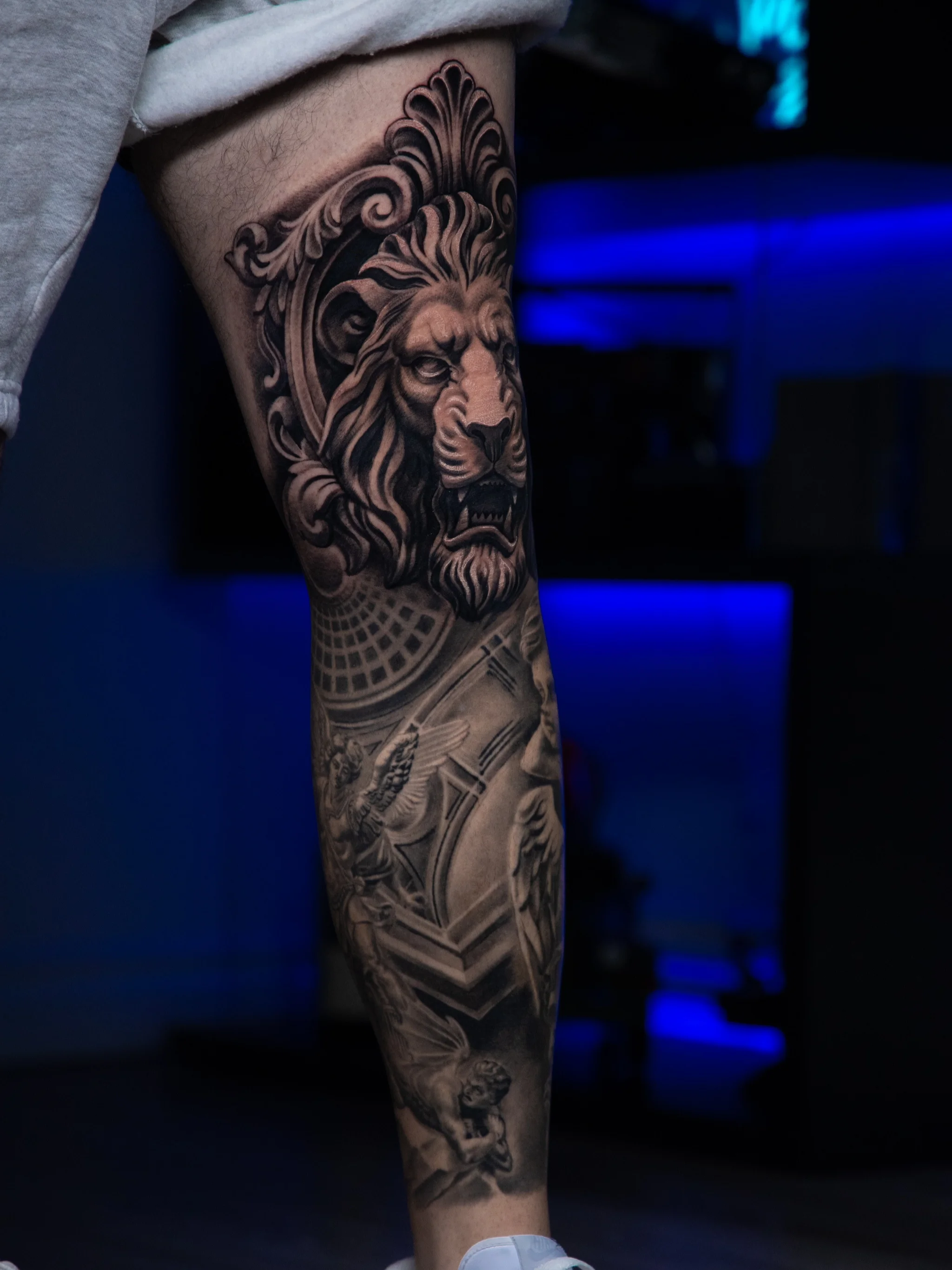 Black & Gray Realism tattoo by T-GRAN Ink: lion, angel, sculpture, ornamental architecture